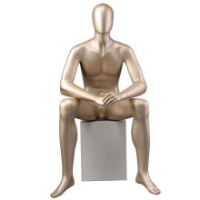 Golden fashion design boutique abstract egg head face full body sitting display male mannequin